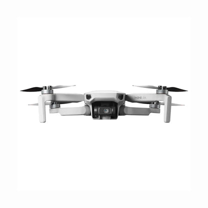 future tech gadgets Canada. cutting edge electronics online Canada. DJI Mini 4K Quadcopter Drone with Camera & Controller. Gallery image 1. The drone is centered in the frame, viewed from the front with its arms extended. It features a sleek, matte white body with black accents on the propellers. The camera is prominently positioned at the front, with the text "MINI 4K" visible on the side. The background is a seamless white, enhancing the drone's clean design.