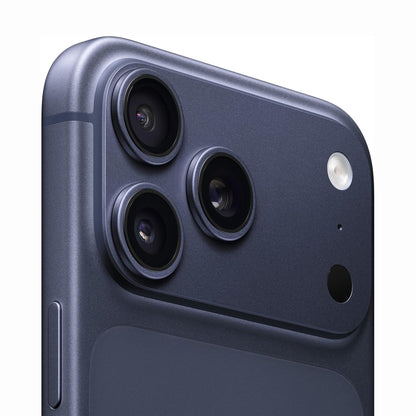 future tech gadgets Canada. cutting edge electronics online Canada. New Apple iPhone 17 Pro Max. Gallery image 6. The image features a close-up view of a smartphone's rear camera module, positioned at an angle in the top corner of the frame. The device has a sleek, matte navy blue finish, with three circular camera lenses prominently displayed, each encircled by a thin metallic trim. A small flash is located to the right of the lenses, and a microphone hole is visible nearby.