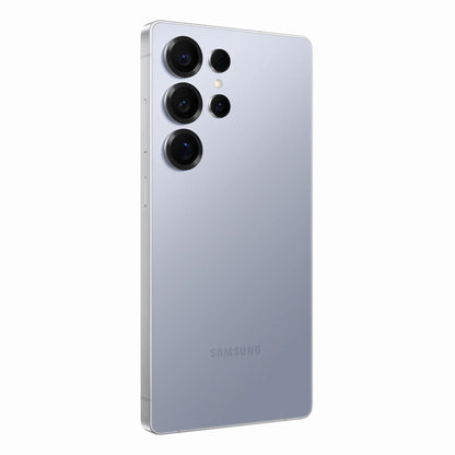 smart tech store Canada. next gen electronics shop. New Samsung Galaxy S25 Ultra. Gallery image 12. The smartphone is positioned at a slight angle, showcasing its sleek, reflective silver back. Four circular camera lenses are arranged vertically on the upper left, with a small flash located above them. The surface beneath the phone is a smooth, light-colored backdrop that enhances the device's modern aesthetic. The brand name "SAMSUNG" is subtly printed near the bottom.