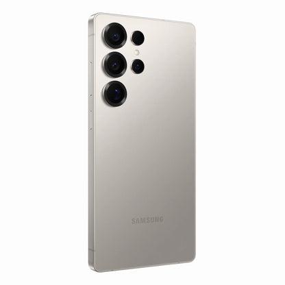 smart tech store Canada. next gen electronics shop. New Samsung Galaxy S25 Ultra. Gallery image 11. The smartphone is positioned at a slight angle, showcasing its sleek, metallic silver back. Three circular camera lenses are prominently arranged in the upper left corner, with a smaller lens above them, all set against a smooth, reflective surface. The device's brand name, "SAMSUNG," is visible near the bottom.