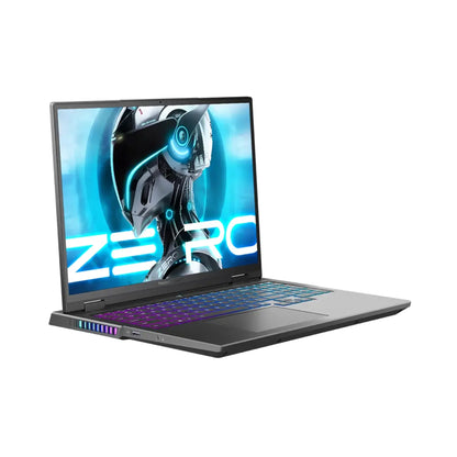 future tech gadgets Canada. smart tech store Canada. ThundeRobot ZERO16 Pro U7255HX57TE1Q360ARB Gaming Laptop. Gallery image 5. The laptop is positioned at a slight angle, showcasing its sleek design and illuminated keyboard. The screen displays a vibrant graphic featuring a futuristic robotic head with blue accents and the word "ZERO" in bold white letters. The body of the laptop is a matte black, with a glossy finish on the screen.