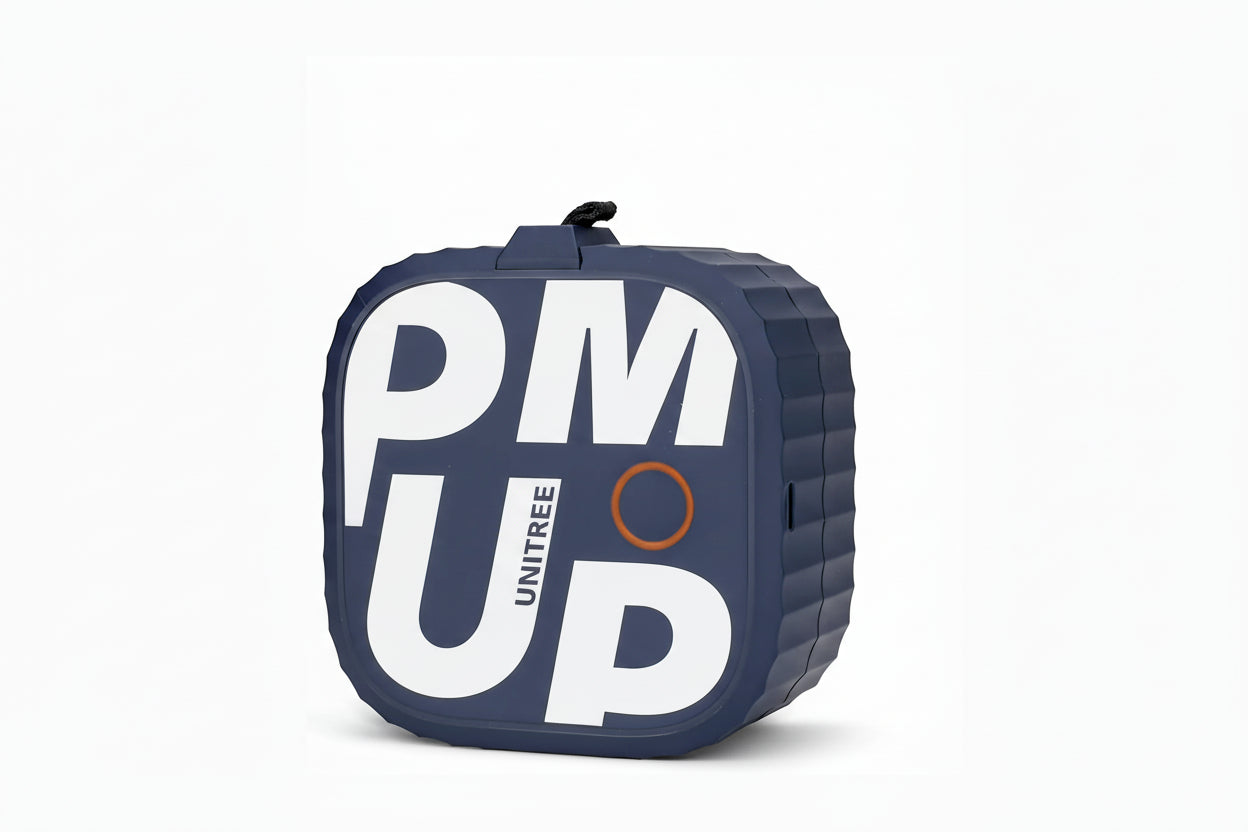 future tech gadgets Canada. smart tech store Canada. Unitree Pump Pro Fitness Pump. Gallery image 1. The product is a compact, square-shaped device with a textured, dark blue exterior. It features bold white lettering that spells "PM UP" prominently on the front, along with the word "UNITREE" in smaller text. An orange circle is visible near the center, possibly indicating a button or status light.