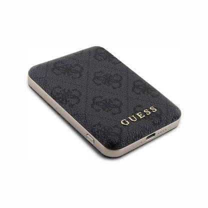future tech gadgets Canada. premium tech accessories Canada. Guess BP MagSafe Case + PWB 5000mAh 4G. Gallery image 4. The product is a black wallet with a textured surface featuring a subtle pattern. It is angled slightly to the right, showcasing the smooth, metallic edge and a gold "GUESS" logo prominently displayed on the front. The background is a seamless white, emphasizing the wallet's design. The lighting is soft, highlighting the texture without harsh shadows.