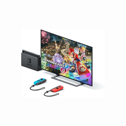 cutting edge electronics online Canada. buy electronics online Canada. New Nintendo Switch OLED Mario kart Deluxe Edition. Gallery image 3. A sleek television displays vibrant graphics from the game "Mario Kart 8 Deluxe," featuring colorful characters and a festive background. To the left, a Nintendo Switch console is positioned vertically, with its logo visible. Two Joy-Con controllers, one blue and one red, are placed in front of the TV, each attached to wrist straps.