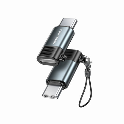 future tech gadgets Canada. premium tech accessories Canada. Techtron Lightning to USB C Mini Adapter. Gallery image 1. The image features a dual-ended USB flash drive positioned at an angle, showcasing both ends clearly. The body is primarily a sleek metallic blue with a matte finish, accented by a black rubber grip section. A small keychain loop is attached to one end, allowing for easy portability. The brand name "TECHTRON" is visible on the side of the drive.