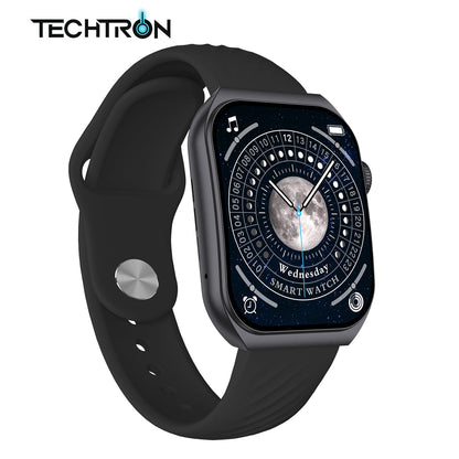 smart tech store Canada. premium tech accessories Canada. Techtron Aurafit AM10B Smart Watch. Gallery image 2. The smartwatch is prominently displayed at an angle, showcasing its sleek rectangular face and black silicone strap. The screen features a dark, starry background with a prominent moon and a circular clock design, indicating the day as "Wednesday" and labeled "SMART WATCH." A silver button is visible on the left side of the strap, while the right side has a textured crown.