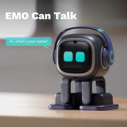 smart tech store Canada. premium tech accessories Canada. Living AI EMO AI Desktop Pet Companion Robot. Gallery image 2. A small, cartoonish robot named EMO is centered in the frame, sitting on a light wooden surface. It has a rounded body with a matte black finish, accented by a silver trim around its face and purple headphones. The robot's eyes are bright turquoise squares, giving it a friendly appearance.