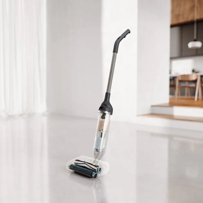 future tech gadgets Canada. smart tech store Canada. HiZero F300 All-in-One Bionic Floor Cleaner. Gallery image 3. A sleek, upright floor cleaner is positioned at an angle in the foreground, with its transparent water tank prominently visible. The cleaner features a black handle and a silver pole, resting on a white cleaning pad that has a dark roller brush. The background shows a softly lit, modern kitchen with wooden accents and a dining area, enhancing the product's contemporary feel.