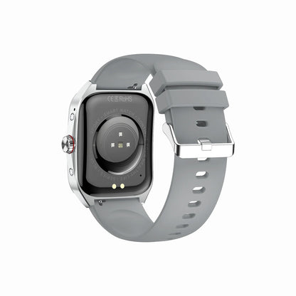 future tech gadgets Canada. smart tech store Canada. Techtron FAMO89S Fashion Smart Watch. Gallery image 12. The smartwatch is shown from a slightly angled view, highlighting its back. The body is black with a glossy finish, while the strap is a soft, light gray rubber with multiple ventilation holes. A circular sensor is visible in the center, surrounded by two small lights. The watch's side features a prominent silver button.