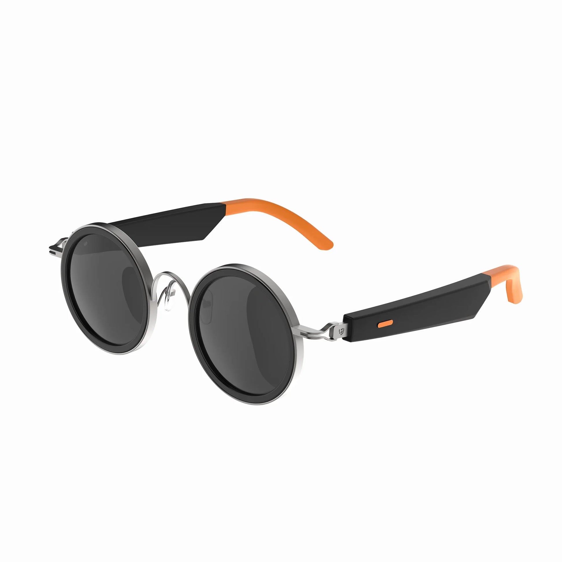 future tech gadgets Canada. smart tech store Canada. Techtron Oracle Smart Sunglasses. Gallery image 3. The sunglasses are displayed at a slight angle, showcasing their round lenses and stylish design. The frames are predominantly black with glossy accents, complemented by vibrant orange tips on the arms. The lenses are dark and reflective, creating a sleek appearance. The background is a seamless white, emphasizing the product's features without distractions.