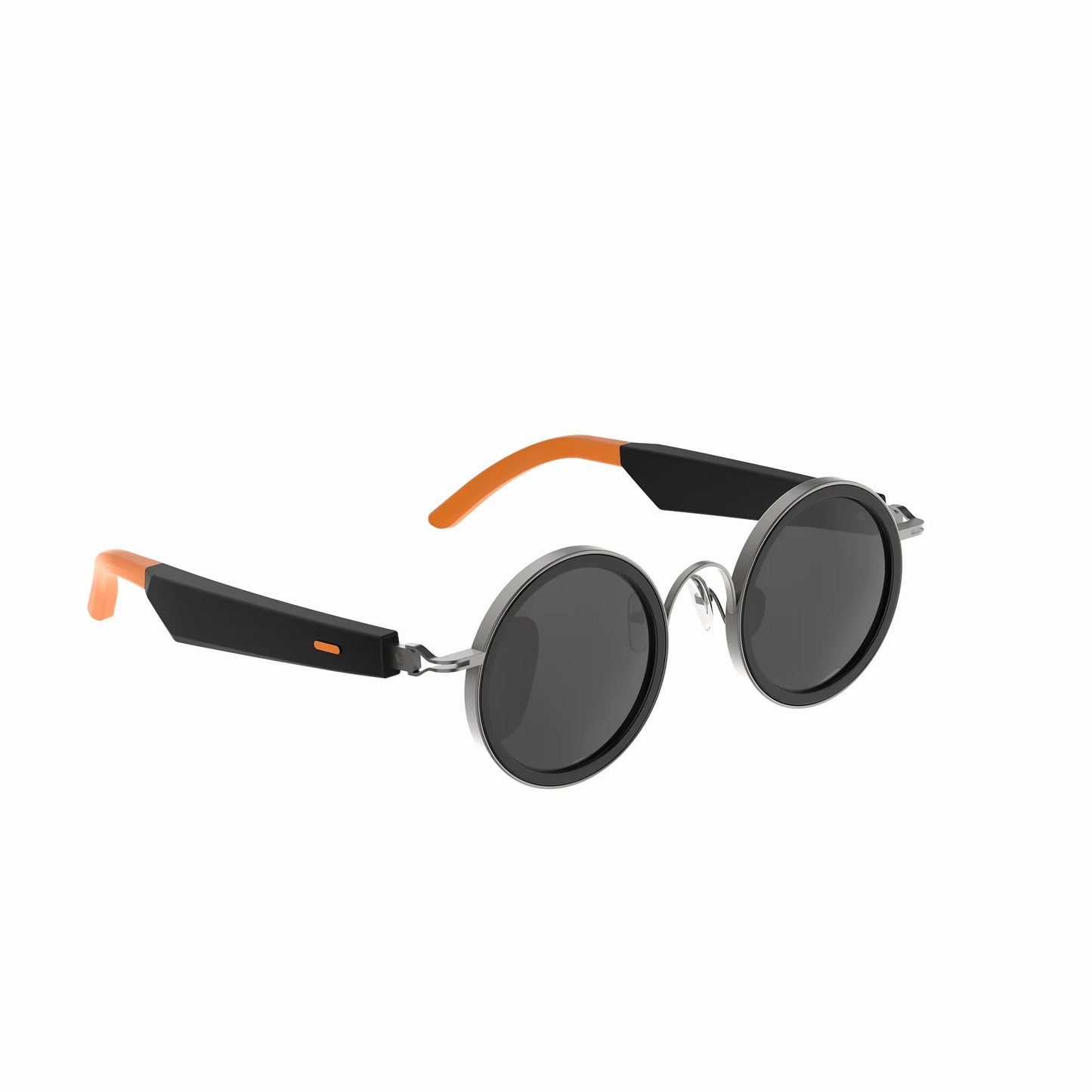 future tech gadgets Canada. smart tech store Canada. Techtron Oracle Smart Sunglasses. Gallery image 5. The sunglasses are displayed at a slight angle, showcasing their round lenses and sleek design. The frames are primarily black with glossy accents, while the temples feature vibrant orange tips. The lenses are dark, reflecting light subtly. The background is a seamless white, emphasizing the product's modern aesthetic. There are no visible logos or text on the sunglasses.