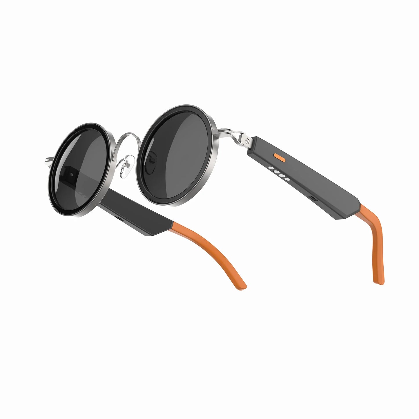 future tech gadgets Canada. smart tech store Canada. Techtron Oracle Smart Sunglasses. Gallery image 7. The sunglasses are displayed at an angle, showcasing their round black lenses and sleek design. The frame features a shiny silver finish around the lenses, with a matte black section on the arms that includes an orange accent on the tips. The right arm has three small buttons and a status LED, indicating functionality.