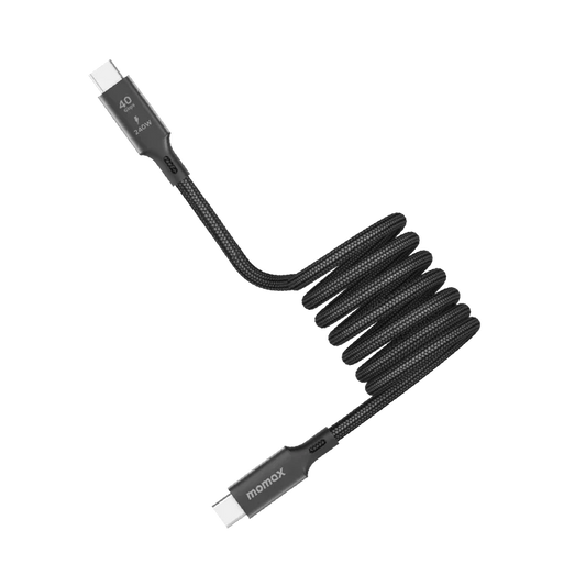 next gen electronics shop. buy electronics online Canada. Momax Mag.Link 240W Usb-C To Usb-C Usb 4 40Gbps Magnetic Cable 1.5M. Gallery image 1. A coiled black charging cable is prominently displayed against a white background. The cable features a textured fabric exterior, giving it a durable appearance. One end has a connector with a white tip, while the other end is slightly angled, showcasing the brand name "momax" printed in white.