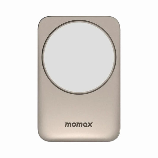 smart tech store Canada. premium tech accessories Canada. Momax 1-Charge Q.Port Qi2 3-in-1 Magnetic Wireless Charging Stand. Gallery image 1. The product is a sleek, rectangular wireless charger with a smooth, metallic gold finish. It features a prominent circular charging area in the center, which is white and slightly raised. The brand name "momax" is printed in small, dark letters near the bottom edge.