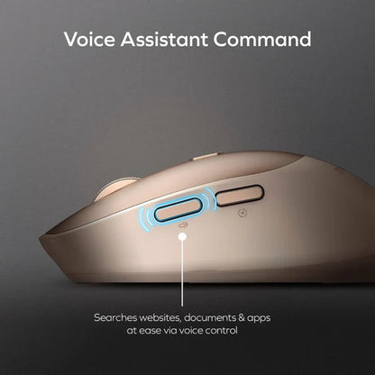 future tech gadgets Canada. smart tech store Canada. Momax 1-Folio A.I. Mouse. Gallery image 2. The image features a close-up view of a sleek, gold-colored computer mouse positioned at an angle against a dark grey background. The mouse has a smooth, glossy finish with a prominent button labeled "Voice Assistant Command," highlighted by a blue glow.