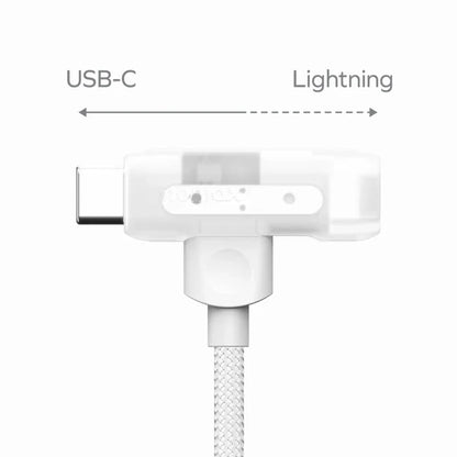 future tech gadgets Canada. premium tech accessories Canada. Momax 1-Link Flow Duo 2-in-1 Braided Cable 1.5M. Gallery image 7. The image features a USB-C to Lightning adapter, positioned centrally against a clean white background. The adapter has a transparent casing, revealing internal components, and a textured white braided cable extending from its base. The USB-C end is on the left, while the Lightning connector is on the right, clearly labeled.