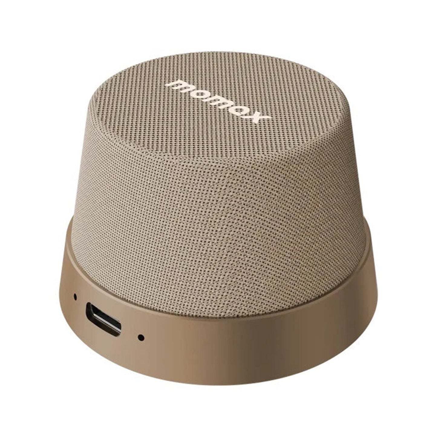 future tech gadgets Canada. premium tech accessories Canada. Momax 1-Vibe Go Magnetic Wireless Speaker. Gallery image 4. The speaker is positioned slightly off-center, showcasing its rounded, compact design. It features a textured beige fabric covering the top and sides, with a smooth, matte brown base. A small port is visible on the side, indicating where a charging cable can be connected. The lighting is soft, highlighting the speaker's contours without harsh shadows.