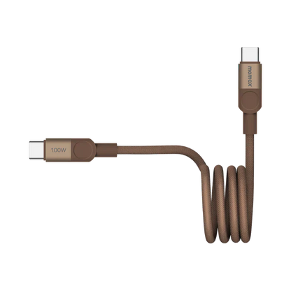 future tech gadgets Canada. smart tech store Canada. Momax Mag.Link 100W Usb-C To Usb-C Magnetic Cable 1M. Gallery image 10. A brown braided charging cable is displayed against a seamless white background, positioned diagonally across the frame. One end features a USB-C connector with a small label reading "100W," while the other end has a similar connector with the brand name "momax" printed on it. The cable is coiled neatly in the middle, showcasing its flexible design.