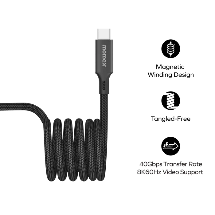 next gen electronics shop. buy electronics online Canada. Momax Mag.Link 240W Usb-C To Usb-C Usb 4 40Gbps Magnetic Cable 1.5M. Gallery image 2. The image features a black braided USB-C charging cable coiled neatly in the center of the frame. The cable has a smooth, matte finish with a sturdy connector at one end, displaying the brand name "momax" in white lettering. The background is plain and dark, emphasizing the cable's design.