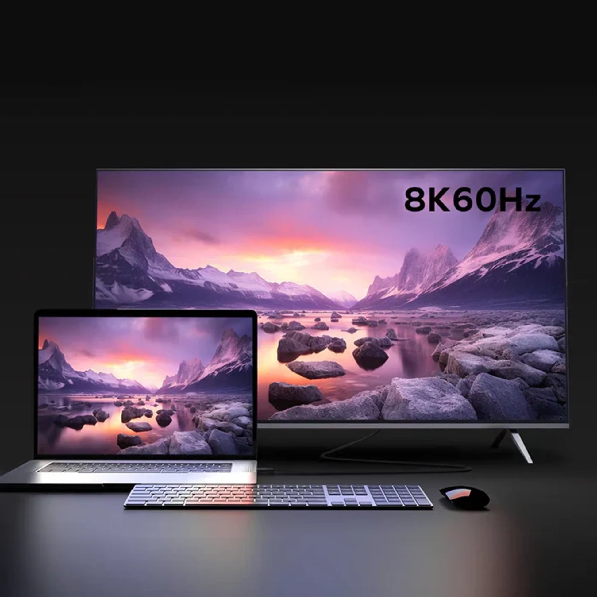 next gen electronics shop. buy electronics online Canada. Momax Mag.Link 240W Usb-C To Usb-C Usb 4 40Gbps Magnetic Cable 1.5M. Gallery image 5. A sleek laptop sits on a dark surface in the foreground, displaying a vibrant landscape scene with mountains and a colorful sky. Behind it, a large television screen showcases the same image, with the text "8K 60Hz" prominently displayed in the upper right corner.