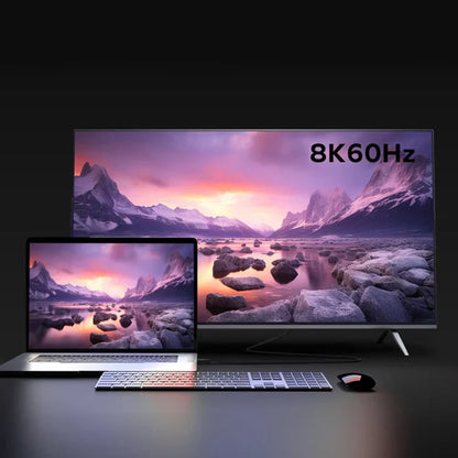 next gen electronics shop. buy electronics online Canada. Momax Mag.Link 240W Usb-C To Usb-C Usb 4 40Gbps Magnetic Cable 1.5M. Gallery image 5. A sleek laptop sits on a dark surface in the foreground, displaying a vibrant landscape scene with mountains and a colorful sky. Behind it, a large television screen showcases the same image, with the text "8K 60Hz" prominently displayed in the upper right corner.