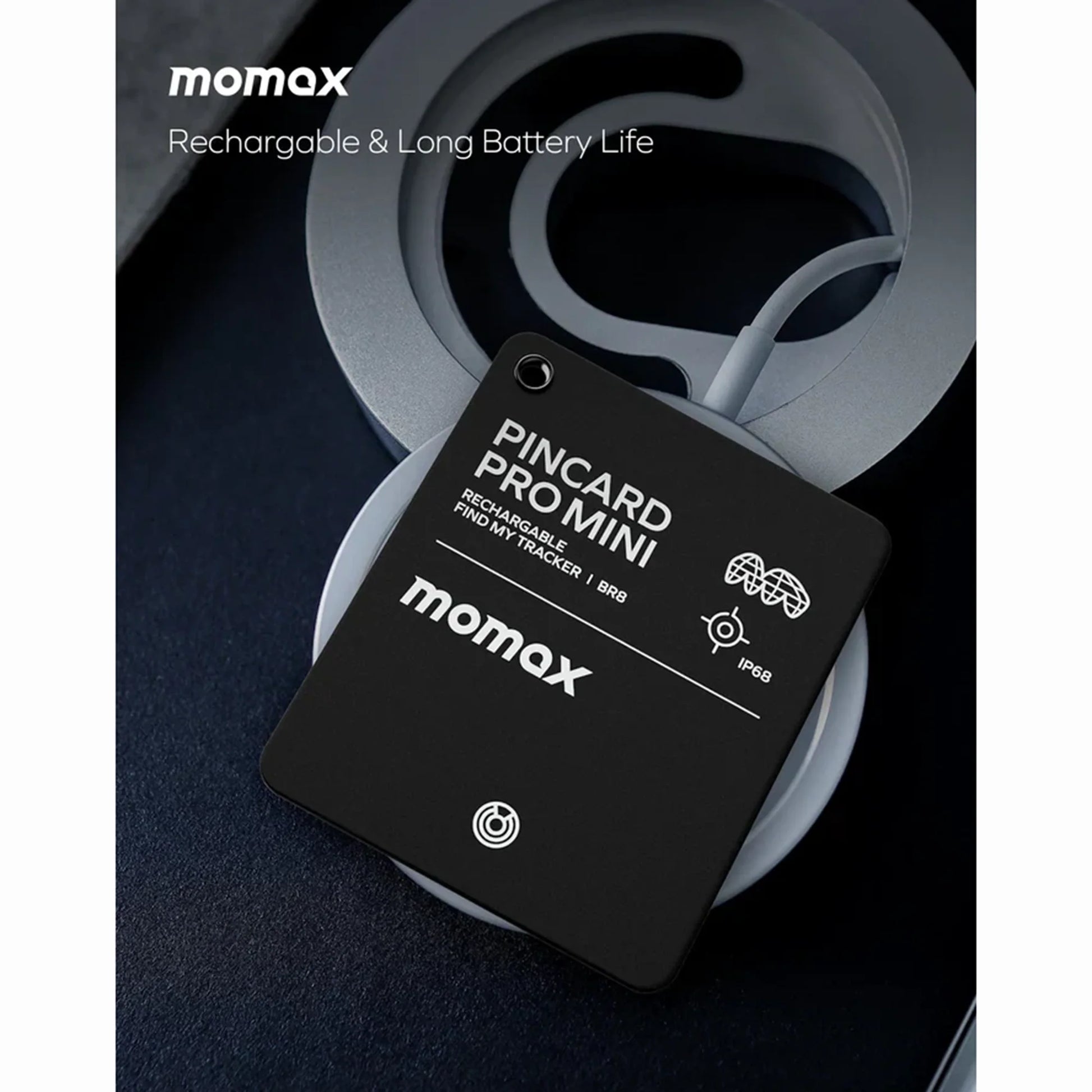 future tech gadgets Canada. smart tech store Canada. Momax Pincard Pro Mini Rechargeable Find My Tracker. Gallery image 3. The image features a black tracking card, labeled "PINCARD PRO MINI," prominently displayed in the center. It rests on a soft, circular gray surface, with a subtle texture that contrasts against the dark background.