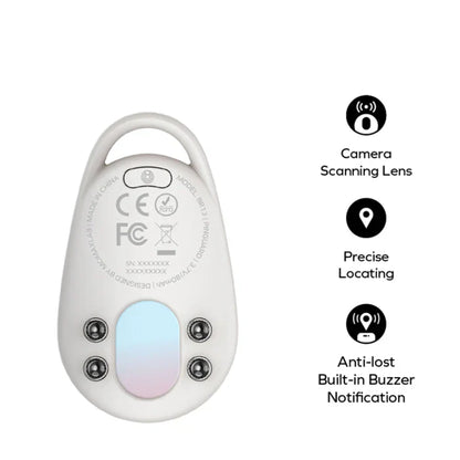 future tech gadgets Canada. smart tech store Canada. Momax Pinguard Camera Scanning Find My Locator. Gallery image 6. The product is a small, oval-shaped tracking device, predominantly white with a smooth finish. It is positioned centrally against a seamless white background, showcasing its back side. The device features a circular scanning lens at the top, flanked by three small buttons below. There is a light blue area in the center, likely indicating functionality.