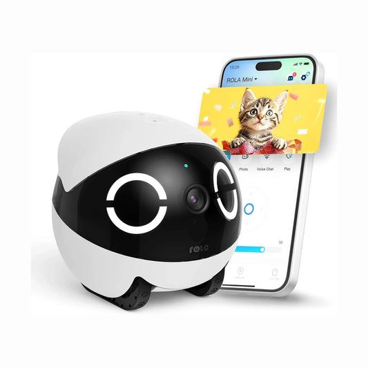smart tech store Canada. premium tech accessories Canada. Enabot Rola Mini Companion Robot. Gallery image 1. A round, robotic device with a glossy black front and a matte white top sits prominently in the foreground, showcasing large, circular eyes that light up. The device features a small camera lens and a button on its front. To the right, a smartphone displays a colorful image of a cat, with the app interface visible below.