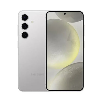 smart tech store Canada. premium tech accessories Canada. Premium Samsung Galaxy S24. Gallery image 3. The smartphone is positioned centrally, showcasing its sleek design with a glossy silver finish. The front features a large display with minimal bezels, highlighting a soft, abstract background of light colors and shapes. Three circular camera lenses are visible on the back, arranged vertically, along with a small flash.