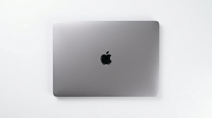 future tech gadgets Canada. smart tech store Canada. Certified Apple MacBook Pro 13″ (2020) A2251. Gallery image 4. The laptop is centered in the frame, showcasing its sleek, metallic gray exterior. The surface is smooth with a subtle brushed finish, and the iconic black Apple logo is prominently displayed in the center. The background is a seamless white, enhancing the product's minimalist design.
