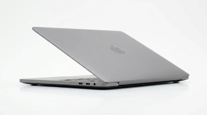 future tech gadgets Canada. smart tech store Canada. Certified Apple MacBook Pro 13″ (2020) A2251. Gallery image 6. The laptop is positioned at a slight angle, showcasing its sleek, metallic gray exterior. The Apple logo is visible on the lid, reflecting light softly. The device rests on a seamless white background, emphasizing its minimalist design. The left side features two USB-C ports and a headphone jack, clearly visible against the smooth surface.