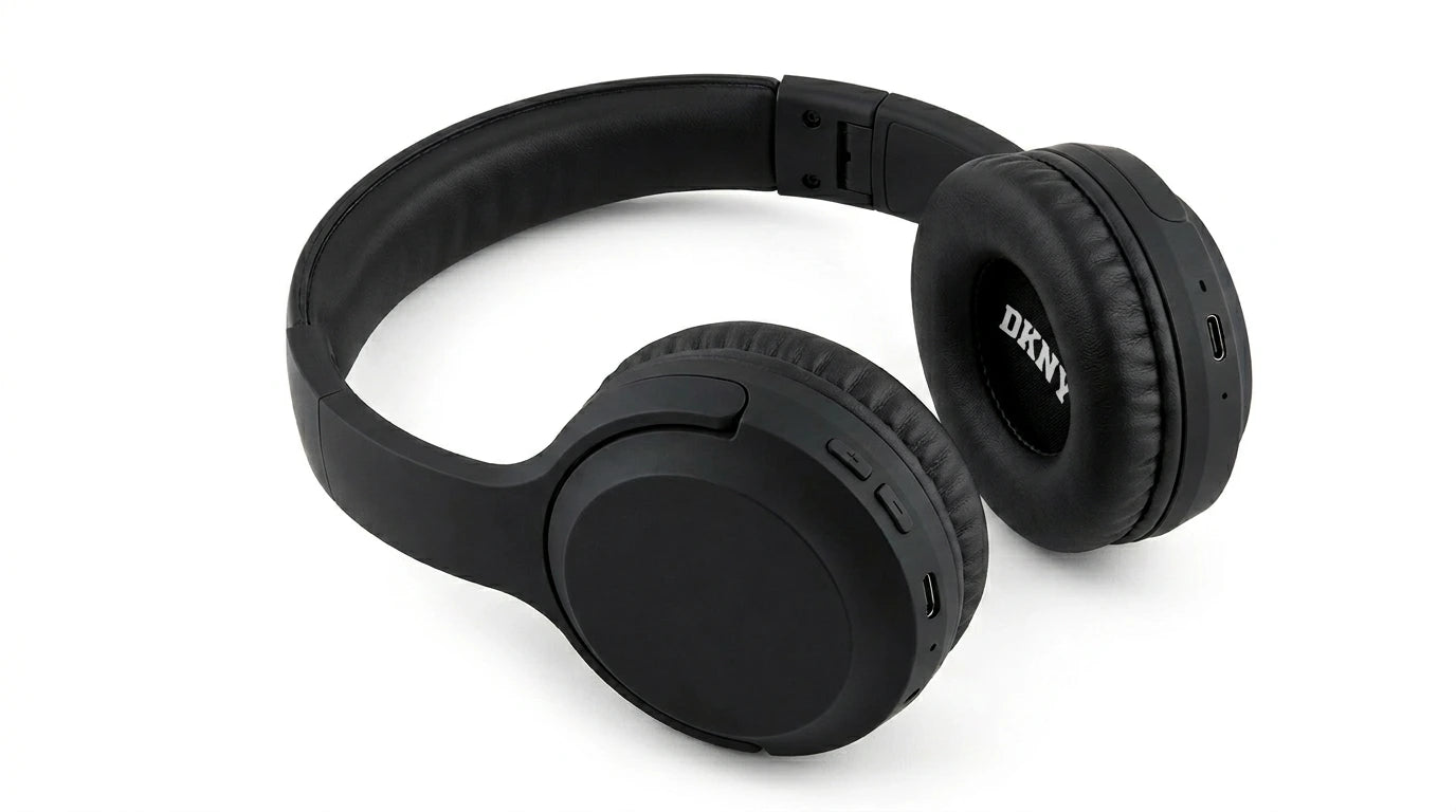 future tech gadgets Canada. premium tech accessories Canada. DKNY Headphones Bluetooth. Gallery image 8. Lines name one specific SKU—never substitute a generic lookalike from the category. After review passes, each render should still read as a fresh studio viewpoint of that same physical unit.