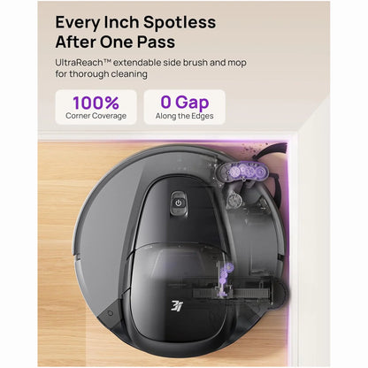 cutting edge electronics online Canada. smart tech store Canada. 3i Smart Robot Vacuum and Mop (G10 +). Gallery image 4. A round robotic vacuum is centered in the frame, showcasing its sleek black and gray design. The vacuum features a prominent power button on the top and an extendable side brush, highlighted in purple, positioned to the right. The background is a light wood surface, enhancing the product's modern aesthetic.