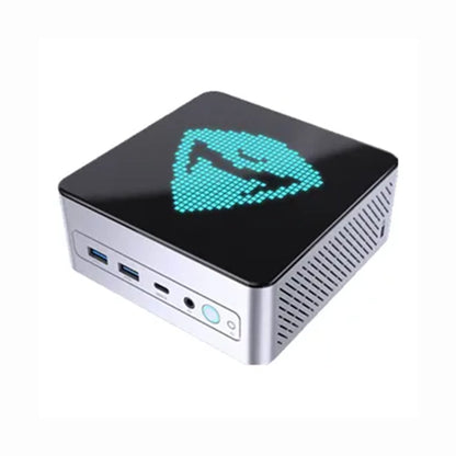 future tech gadgets Canada. gaming handheld PC Canada. Machenike GTX PH94H28 Mini PC. Gallery image 1. The compact device is positioned at a slight angle, showcasing its glossy black top adorned with a turquoise pixelated logo. The sides feature a brushed silver finish with visible ventilation grilles. On the front, there are two USB ports, a USB-C port, and a power button with a blue LED indicator. The background is a seamless white, enhancing the product's sleek design.