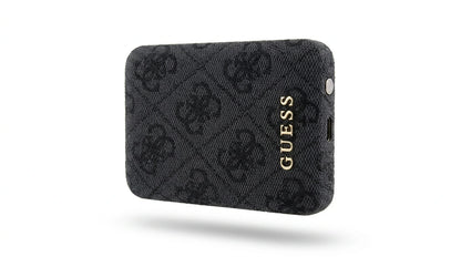 future tech gadgets Canada. premium tech accessories Canada. Guess BP MagSafe Case + PWB 5000mAh 4G. Gallery image 7. The product is a black wallet with a textured surface featuring a subtle pattern of interlocking logos. It is positioned at a slight angle, showcasing its depth and the glossy gold "GUESS" logo on the front. The background is a clean, seamless white, enhancing the wallet's design. The lighting is soft, highlighting the texture of the fabric while casting minimal shadows.