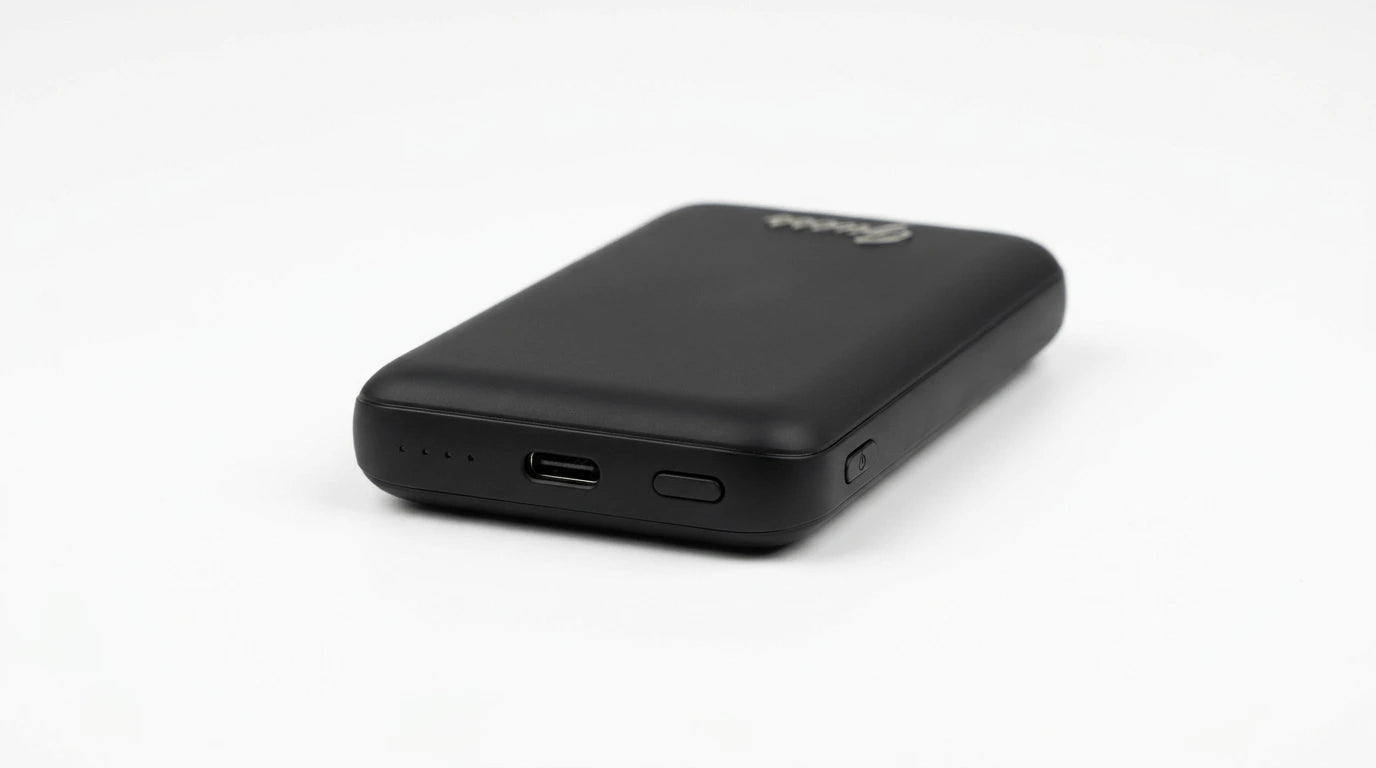 cutting edge electronics online Canada. premium tech accessories Canada. Guess Powerbank Magsafe Metal Script Logo 5000mAh 15W Black. Gallery image 6. Lines name one specific SKU—never substitute a generic lookalike from the category. After review passes, each render should still read as a fresh studio viewpoint of that same physical unit.