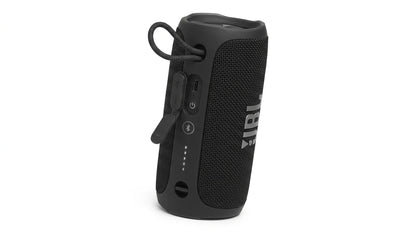 future tech gadgets Canada. smart tech store Canada. JBL Flip 7 Portable waterproof and drop-proof speaker. Gallery image 6. The portable speaker is positioned upright and slightly angled to the right, showcasing its cylindrical shape. It features a textured black fabric exterior with a glossy top and a prominent white JBL logo on the front. On the side, there are several buttons, including a power button and Bluetooth pairing, along with a protective flap covering a USB-C port.