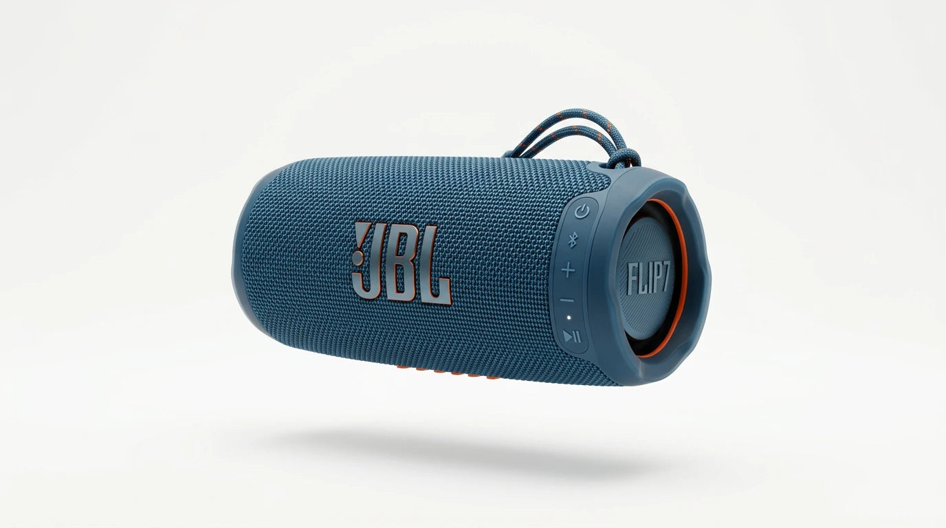 future tech gadgets Canada. smart tech store Canada. JBL Flip 7 Portable waterproof and drop-proof speaker. Gallery image 7. A blue JBL Flip 7 portable speaker is centered in the frame, slightly angled to showcase its rounded shape. The speaker features a textured fabric exterior with a rubberized end cap, and the JBL logo is prominently displayed in white with an orange outline. On the side, there are control buttons for power, Bluetooth, and volume, with a small status LED glowing softly.