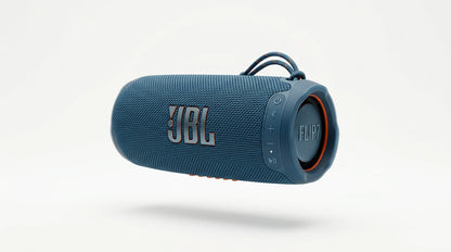 future tech gadgets Canada. smart tech store Canada. JBL Flip 7 Portable waterproof and drop-proof speaker. Gallery image 7. A blue JBL Flip 7 portable speaker is centered in the frame, slightly angled to showcase its rounded shape. The speaker features a textured fabric exterior with a rubberized end cap, and the JBL logo is prominently displayed in white with an orange outline. On the side, there are control buttons for power, Bluetooth, and volume, with a small status LED glowing softly.