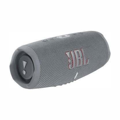 future tech gadgets Canada. premium tech accessories Canada. JBL Charge 5 Portable Waterproof Speaker with Powerbank. Gallery image 2. The speaker is positioned at a slight angle, showcasing its cylindrical shape and textured gray fabric covering. The prominent red "JBL" logo is displayed on the front, alongside a circular control button with an exclamation mark. The background is a seamless white, emphasizing the product's design.
