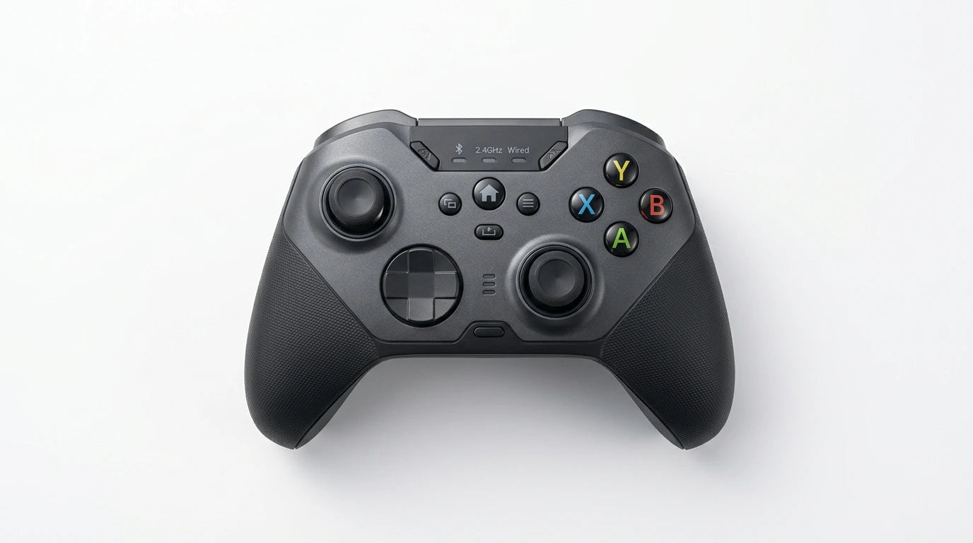 future tech gadgets Canada. premium tech accessories Canada. Machenike G5 Pro V2 Tri-Mode Controller. Gallery image 4. The game controller is centered in the frame, viewed from above against a seamless white background. Its body is predominantly matte black with textured grips on the sides. The controller features two analog sticks, a directional pad, and four colored buttons labeled A, B, X, and Y in red, green, blue, and yellow, respectively.