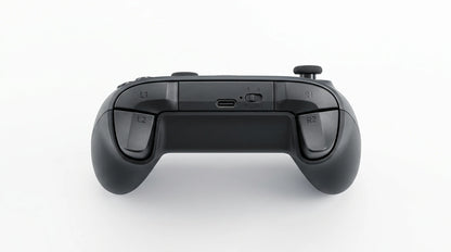 future tech gadgets Canada. premium tech accessories Canada. Machenike G5 Pro V2 Tri-Mode Controller. Gallery image 6. The image shows a black gaming controller viewed from above, centered against a seamless white background. The controller features a textured surface and has four shoulder buttons labeled L1, L2, R1, and R2, positioned on either side.