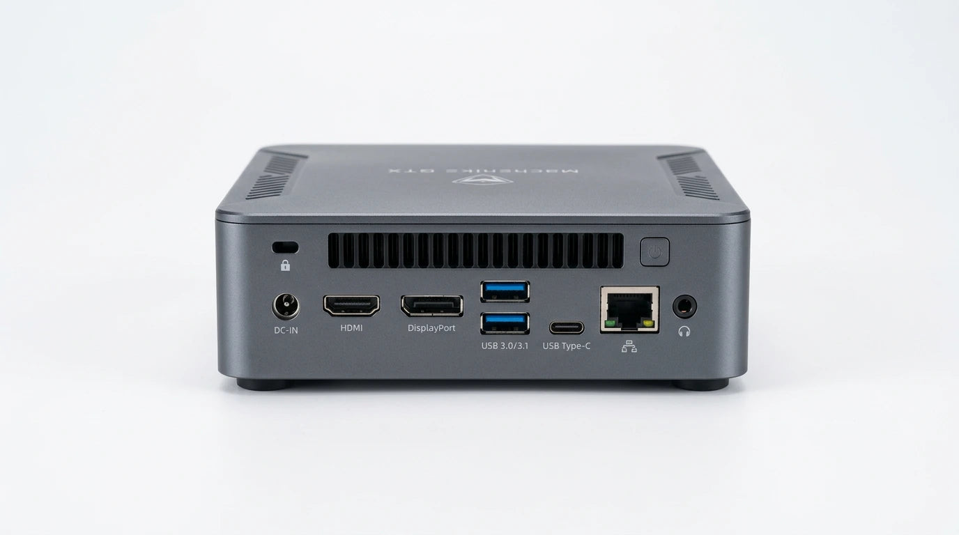 future tech gadgets Canada. gaming handheld PC Canada. Machenike GTX PH94H28 Mini PC. Gallery image 5. The product is a compact gray computer unit, positioned centrally against a seamless white background. The camera captures the rear view, showcasing various ports and connectors, including HDMI, DisplayPort, USB 3.0/3.1, and USB Type-C. The surface has a matte finish, with subtle highlights reflecting the soft studio lighting.