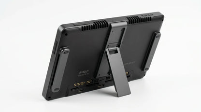 future tech gadgets Canada. gaming handheld PC Canada. ONEXPLAYER X1 PRO 2TB AMD Ryzen™ AI 9 HX 370, 10.95'' 3-In-1 Gaming Handheld PC. Gallery image 6. The product is positioned at an angle, showcasing its rear side against a seamless white background. The device features a matte black finish with a sturdy, adjustable kickstand extended for support. Visible on the back are several ports and a logo, along with a cooling vent at the top.