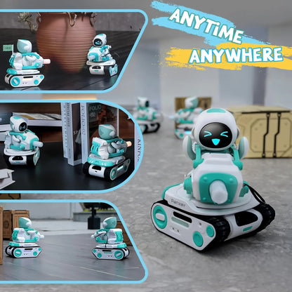 smart tech store Canada. premium tech accessories Canada. Panxer The Exclusive Vehicle Crafted for Eilik Blue. Gallery image 3. A small, playful robot toy is positioned prominently in the foreground, featuring a white and teal color scheme. It has a smiling face displayed on a black screen and is mounted on a tank-like base with rubber treads. The background includes blurred images of similar robots and a few books, suggesting a casual indoor setting.