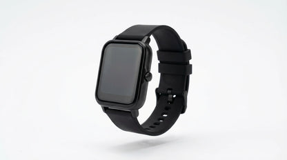 smart tech store Canada. premium tech accessories Canada. Techtron Aurafit AM23 Smart Watch. Gallery image 7. The smartwatch is positioned at a slight angle, showcasing its rectangular face and black silicone strap. The screen is dark and unlit, with a glossy finish that reflects soft light. The strap features multiple adjustment holes and a secure buckle. The background is a seamless white, enhancing the watch's sleek design.