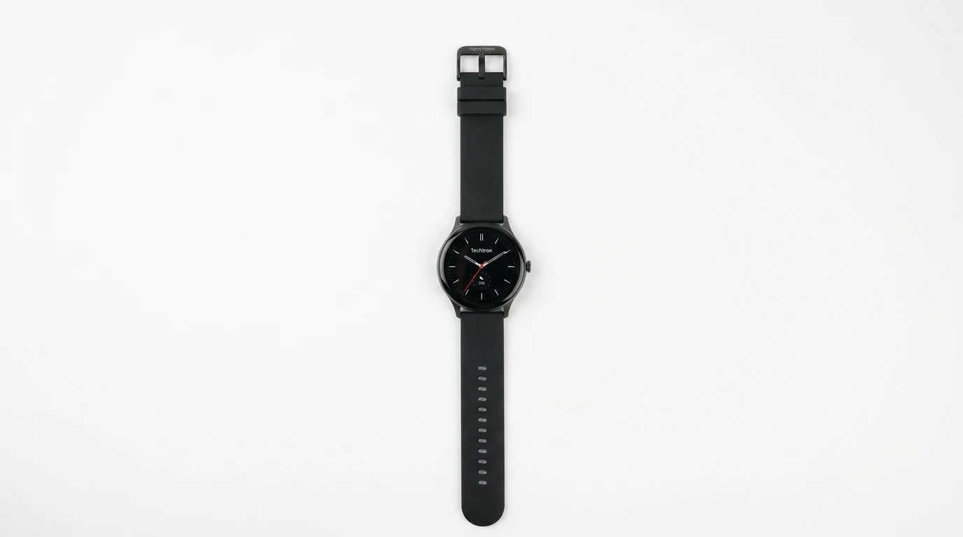 smart tech store Canada. premium tech accessories Canada. Techtron Aurafit AM28 Smart Watch. Gallery image 4. The watch is centered in the frame, displayed horizontally against a seamless white background. It features a round black face with silver hour markers and a prominent red second hand. The strap is matte black rubber with a series of small notches for adjustment. The watch has a sleek, modern design, and the brand name "Techtron" is visible at the top of the watch face.