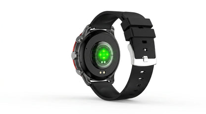 future tech gadgets Canada. smart tech store Canada. Techtron FAMO51 Fashion Smart Watch. Gallery image 8. The image shows the back of a smartwatch positioned at an angle against a seamless white background. The watch features a black body with a glossy finish and a contrasting red accent on the side. A circular sensor with a green light is visible in the center, surrounded by a metallic ring. The strap is made of matte black rubber, secured with a silver buckle.