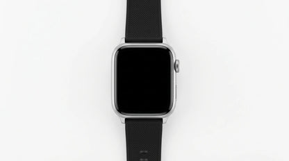 smart tech store Canada. premium tech accessories Canada. Techtron SWH18 (T52 / T67) Smart Watch. Gallery image 2. The smartwatch is centered in the frame, viewed from above against a seamless white background. It features a sleek, square face with a glossy black screen that is currently off. The body is silver, with a smooth finish, and a textured black rubber strap that extends downward. On the right side of the watch, a round button is visible, adding to its modern design.