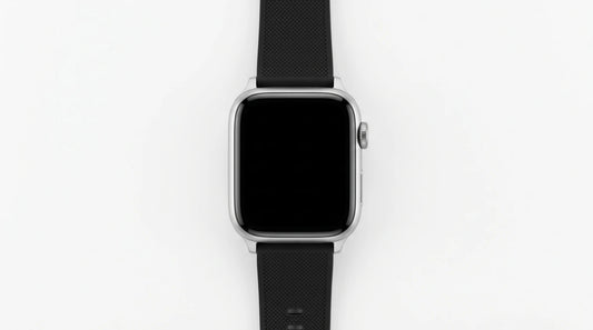 smart tech store Canada. premium tech accessories Canada. Techtron SWH18 (T52 / T67) Smart Watch. Gallery image 2. The smartwatch is centered in the frame, viewed from above against a seamless white background. It features a sleek, square face with a glossy black screen that is currently off. The body is silver, with a smooth finish, and a textured black rubber strap that extends downward. On the right side of the watch, a round button is visible, adding to its modern design.